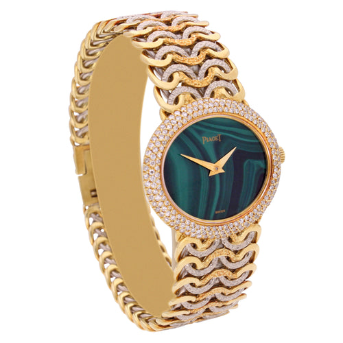 Tri-gold Piaget, reference 98125 'oval cased' bracelet watch with malachite dial and diamond set bezel. Made 1970's