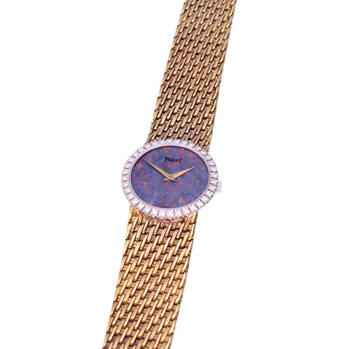 18ct yellow gold Piaget bracelet watch with an opal dial & diamond set bezel. Made 1970