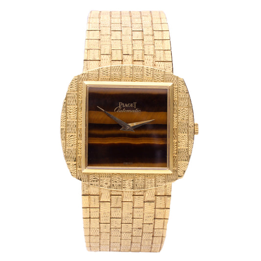 18ct yellow gold Piaget, reference 12461 automatic bracelet watch with tigers eye dial. Made 1971