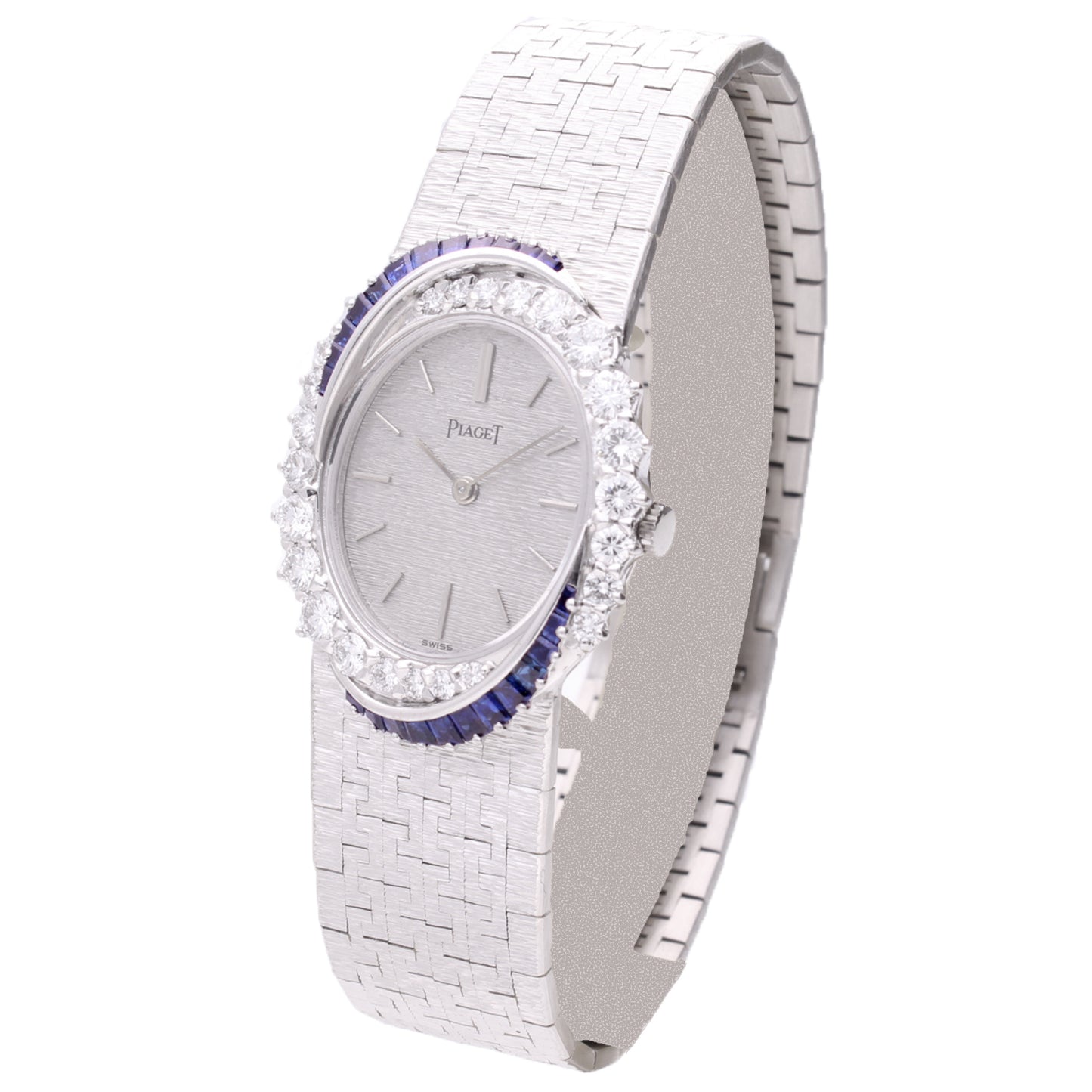 18ct white gold Piaget, diamond and sapphire set bezel bracelet watch. Made 1970