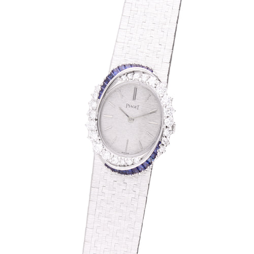 18ct white gold Piaget, diamond and sapphire set bezel bracelet watch. Made 1970