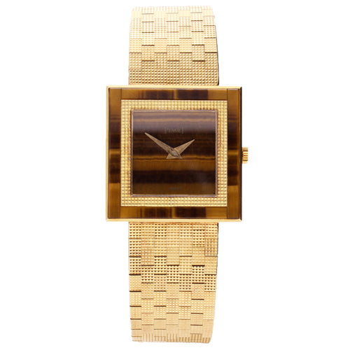 18ct yellow gold Piaget, with tigers eye dial and bezel bracelet watch. Made 1970