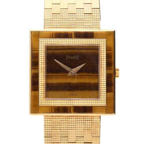 18ct yellow gold Piaget, with tigers eye dial and bezel bracelet watch. Made 1970