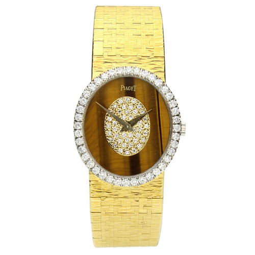 18ct yellow gold, reference  9826 oval cased wristwatch with tigers eye dial. Made 1970's