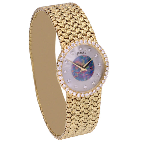 18ct yellow gold Piaget bracelet watch with mother of pearl and opal dial. Made 1970