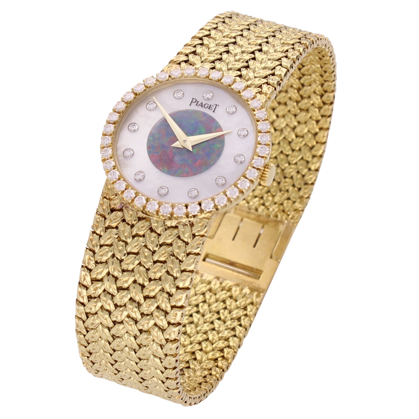 18ct yellow gold Piaget bracelet watch with mother of pearl and opal dial. Made 1970