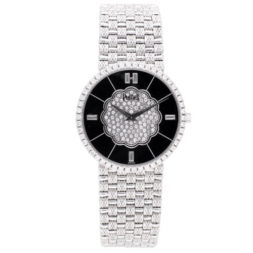 18ct white gold Piaget bracelet watch with onyx dial and diamond set bezel. Made 1989