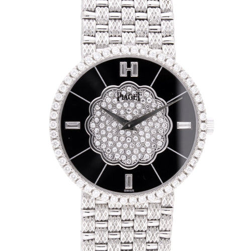 18ct white gold Piaget bracelet watch with onyx dial and diamond set bezel. Made 1989