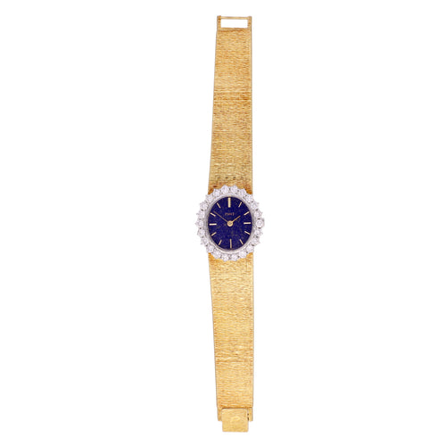 18ct yellow gold 'oval cased' bracelet watch with lapis lazuli dial and diamond set bezel. Made 1970's