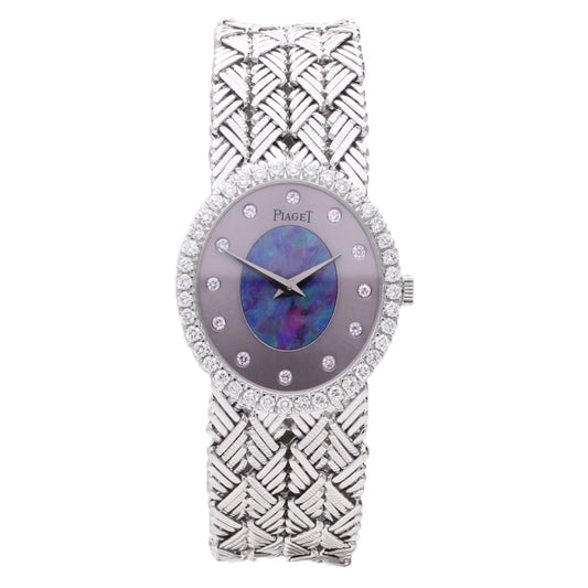 18ct white gold with opal/pearl set dial and diamond set bezel bracelet watch. Made 1970