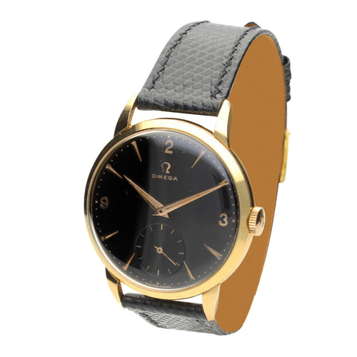 18ct yellow gold OMEGA black dial dress wristwatch. Made 1955