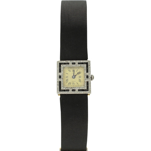 Platinum Cartier, onyx and diamond set cocktail watch. Circa 1920